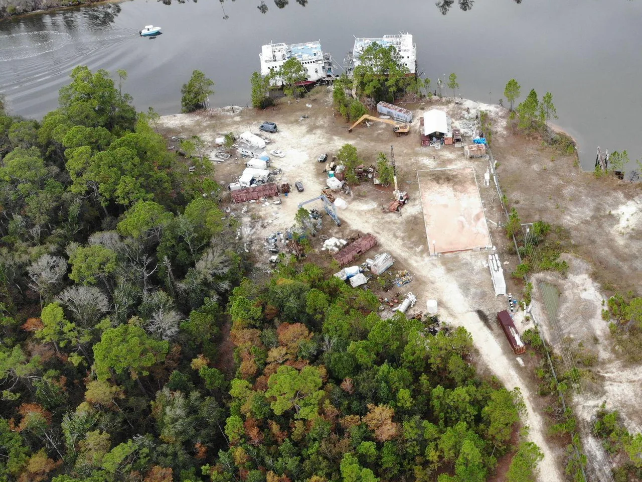 Aerial view of the Gulf County Shipbuilding yard, canal frontage, work pad, and covered workspace